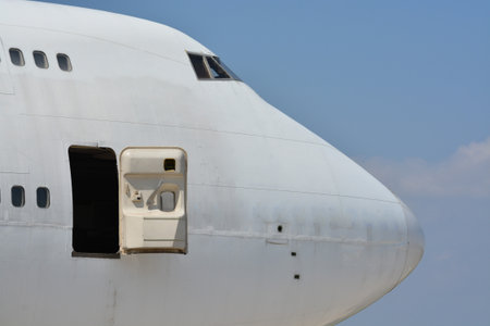 Old passenger airplane out of service and abandoned on the ground.の写真素材