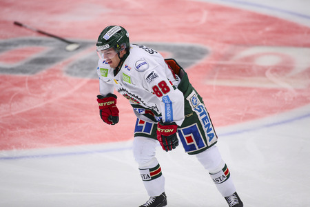 Lulea, Sweden - March 18, 2015. Andreas Johnson  (#88 Frolunda Indians) hurt his knee after a tackle. Swedish Hockey League-game between Lulea Hockey and Frolunda Indians.のeditorial素材