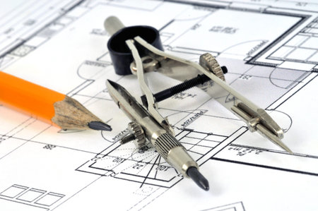 Compass posed on a house plan