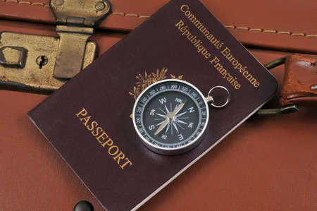 Compass placed on a passportの写真素材