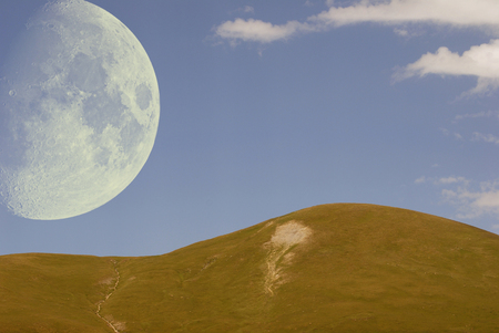 The moon on Mount Emparis in the Alpsの写真素材