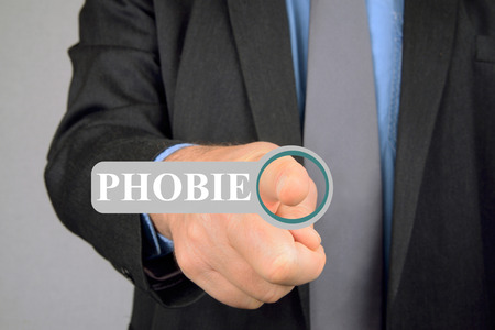 Man pressing the phobia buttonの写真素材