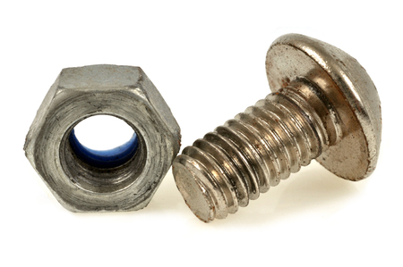 Bolt and nut on white backgroundの写真素材
