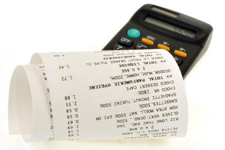 Cash receipt next to a calculator