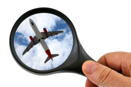 Airplane with a magnifying glassの写真素材