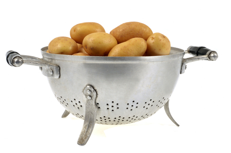 Potatoes in a colanderの写真素材