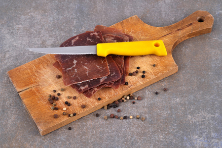 Meat of dried beef on a cutting boardの写真素材