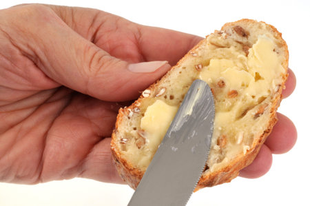 Butter a slice of bread