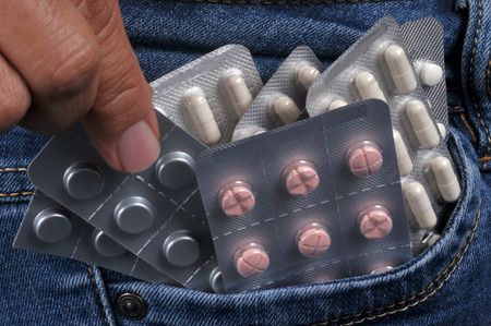 Pads of medicine in the pocket of a jeansの写真素材