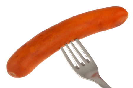 Frankfurter sausage on a forkの写真素材
