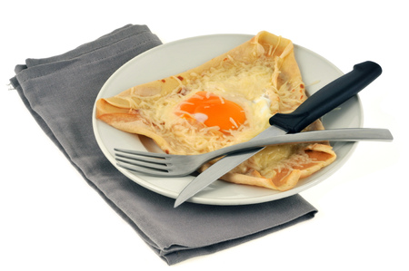 Crepe with an egg and grated cheeseの写真素材