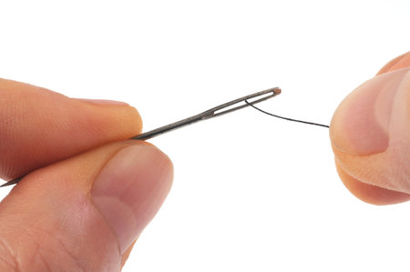 Pass the thread in the eye of the needle