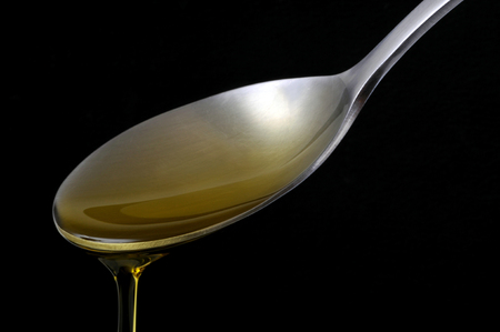 Spoon of oilの写真素材