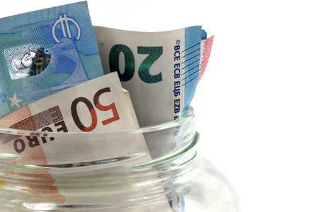 Banknotes in a jarの写真素材