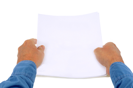 Blank sheets of paper in handの写真素材