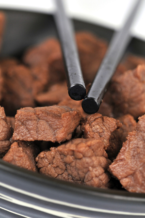 Beef meat with Chinese chopsticksの写真素材