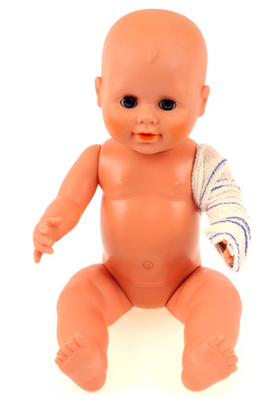 Doll with bandaged armの写真素材