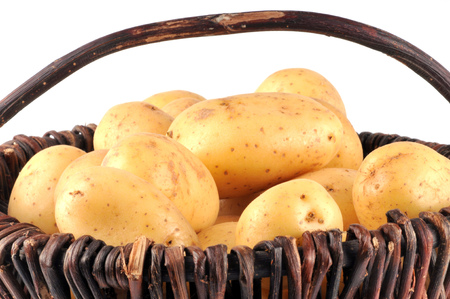 Potatoes in a wicker basketの写真素材