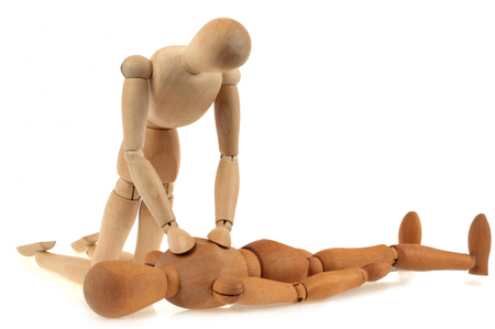 Articulated dummy practicing a cardiac massage on anotherの写真素材