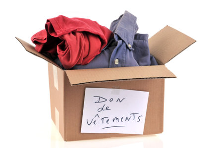 Clothing to give in a cardboard on a white background