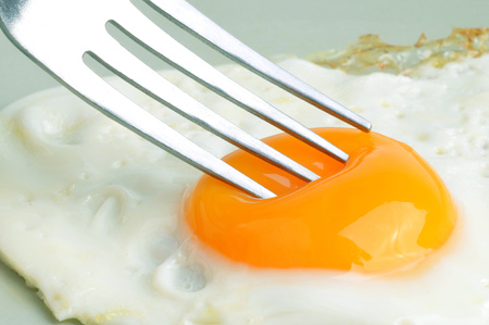 A fried egg in close upの写真素材