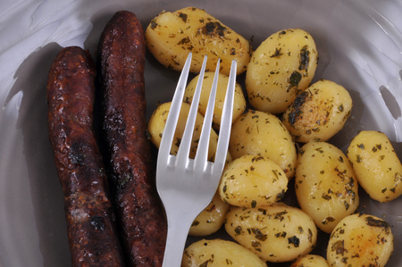 Merguez and potatoes on a plateの写真素材