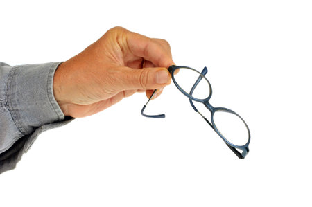 Glasses in hand on a white background