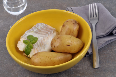 Cod and potatoes on a plate
