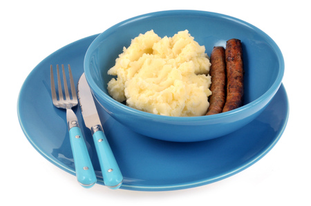 Plate of mashed potatoes and chipolatasの写真素材