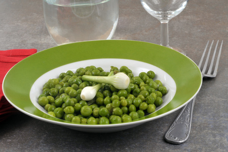 Plate of peas and new onionsの写真素材