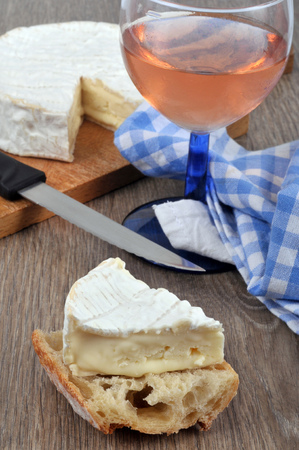 Camembert and piece of breadの写真素材