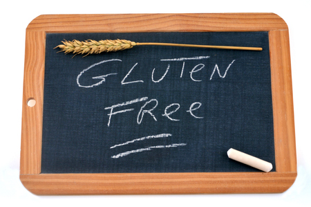Gluten free written on a school slateの写真素材