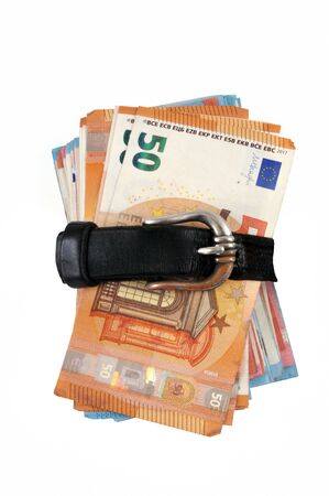 Bundle of euro banknotes attached with a leather beltの写真素材