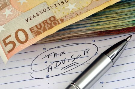 Appointment with a tax advisor noted on an agendaの写真素材