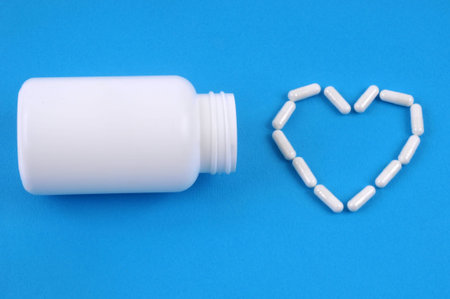 Medicines for heart disease on blue background