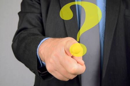 Ask a question online by pressing a virtual question markの写真素材