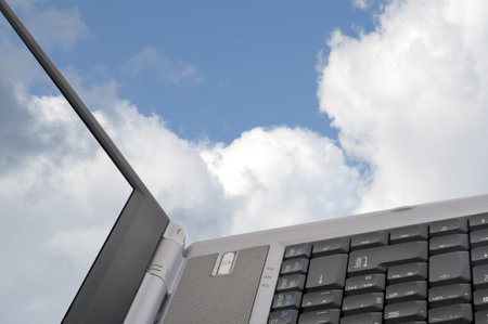 Laptop with cloudy sky close up