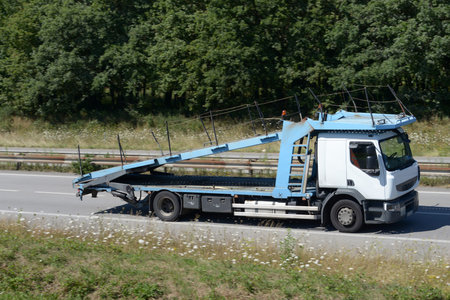 Empty vehicle transport truck driving on an express lane