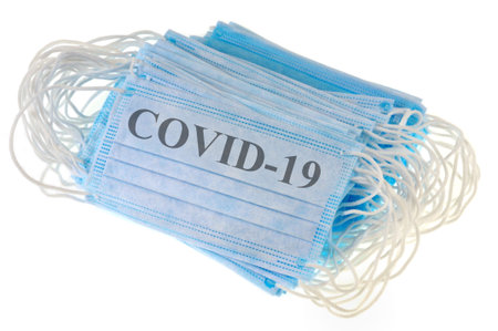Paper masks with covid-19 written on them
