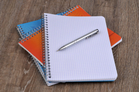 Spiral notebooks with pen close-up