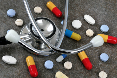Stethoscope and drugs close up