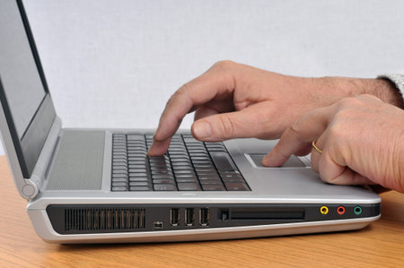 Someone working on a laptop close up