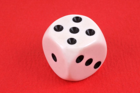 Dice close-up on red background