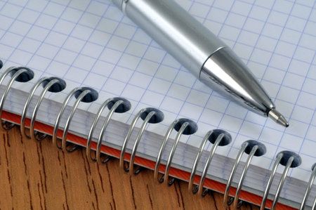 Pen on a spiral notebook close-up