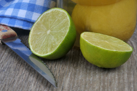 Lime cut in half with a knife close upの写真素材