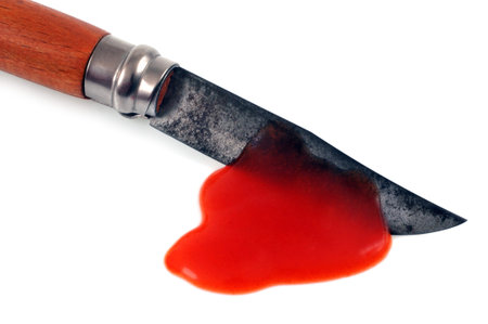 Bloodied knife close-up on white background
