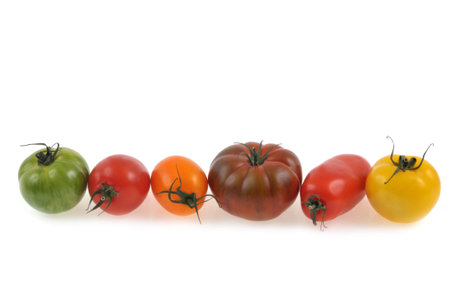 Assortment of tomatoes close-up on white backgroundの写真素材
