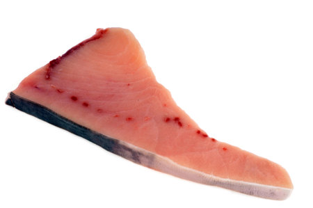 Raw swordfish steak close-up on white backgroundの写真素材