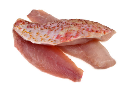 Raw red mullet fillets close-up on white background