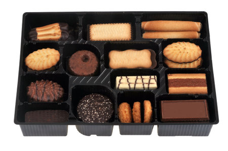 Assortment of cookies in plastic packaging on white backgroundの写真素材